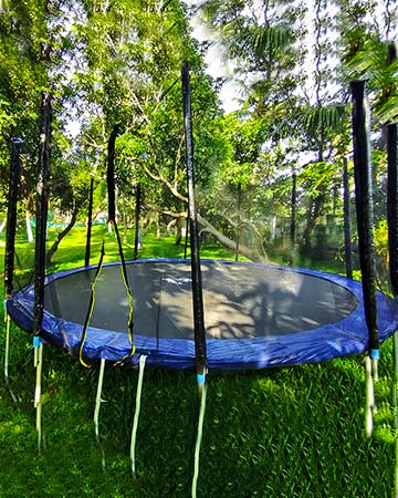 A large trampoline at the resort, with a safety net